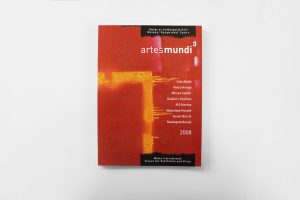 Artes Mundi 3 Catalogue cover, a burnt red with a corner of orange paint marking the bottom left corner, drips of orange fall to the right, small white text sits below the Artes Mundi 3 logo.