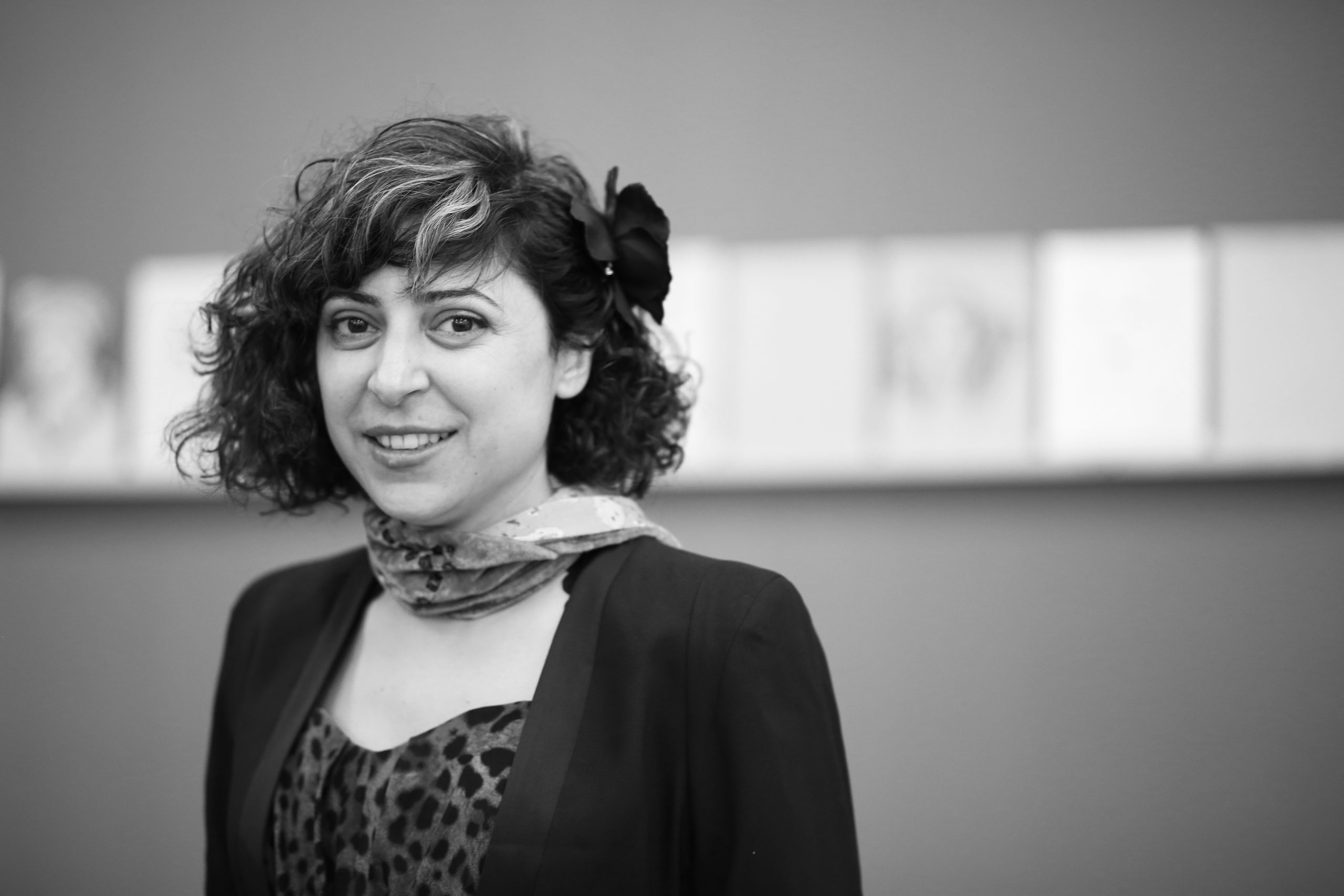 A black and white portrait image of Artes Mundi 10 selected artist, Mounira Al Solh