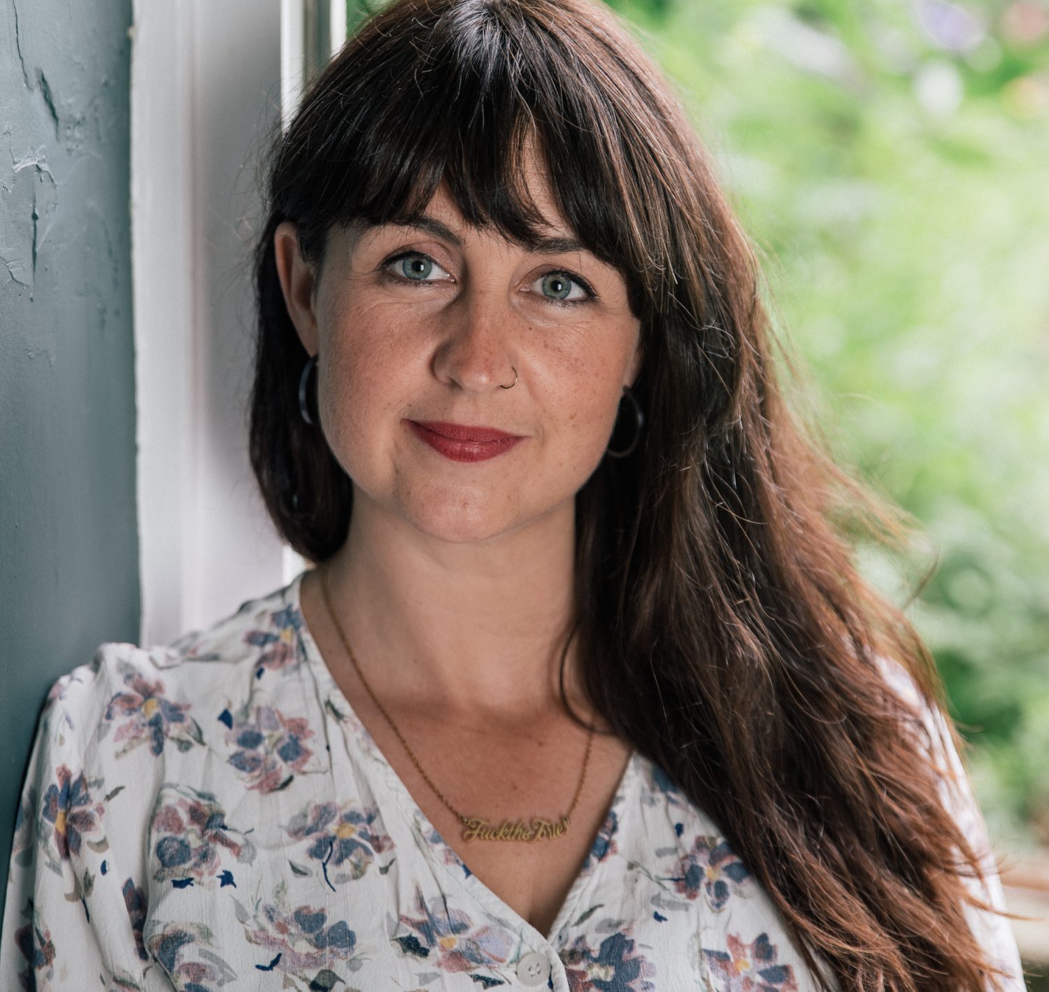 A portrait photo of a woman called Liv Penrose Punnett looking directly at the camera