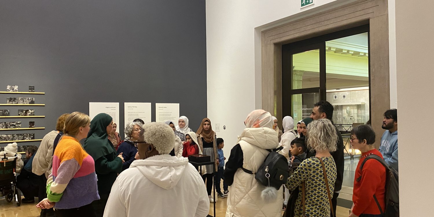 A group of people on an exhibition tour.